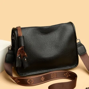Sac porté épaule façon cuir noir avec bandoulière tressée